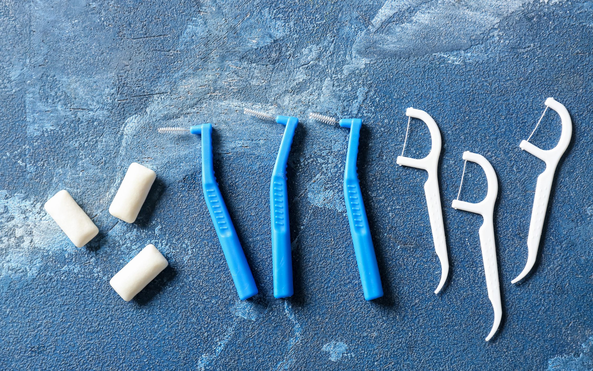 sugar-free gum, interproximal brushes, and floss picks